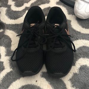 black with rose gold logo athletic nike shoes